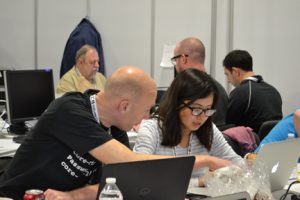Indira Kassymkhanova and Pieter de Boer configure SCinet routers.