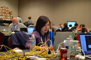 Julia Staats monitoring and measuring SCinet as part of the devops team.